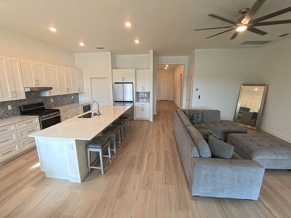 Family Room and Kitchen. Facing front entryway.