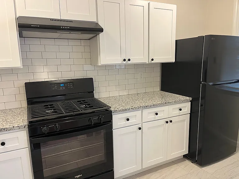Kitchen with new white cabinets and appliances