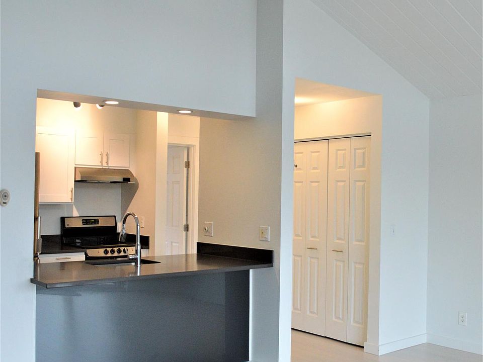 View from living/dining room towards kitchen and bedroom areas