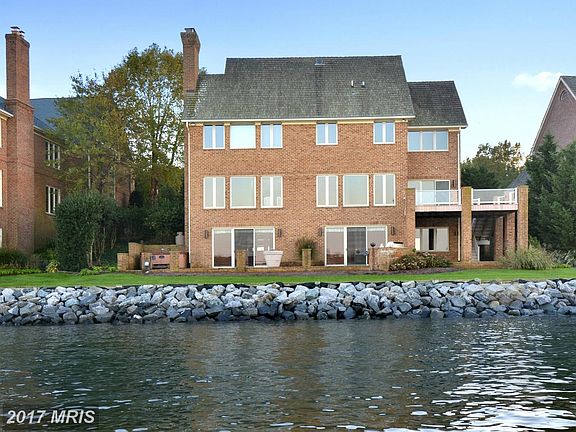 Rear Deck and Patio on Riprapped River Shoreline