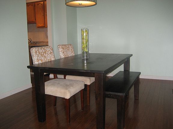 Formal dining room w/designer pendant from Neiman Marcus; Morning Star Strand Carbonized Bamboo floors in all rooms upstairs and down