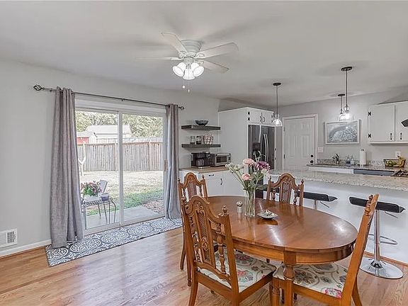 Kitchen featuring updated black stainless steel appliances and large sliding door to backyard. Additional upgrades (not pictured) have been made including backsplash and expanded patio.