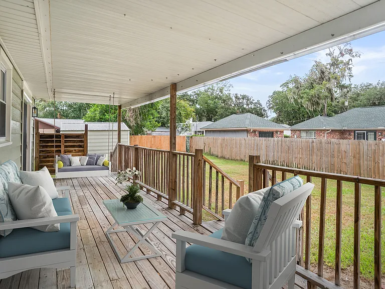 Staged rear covered deck