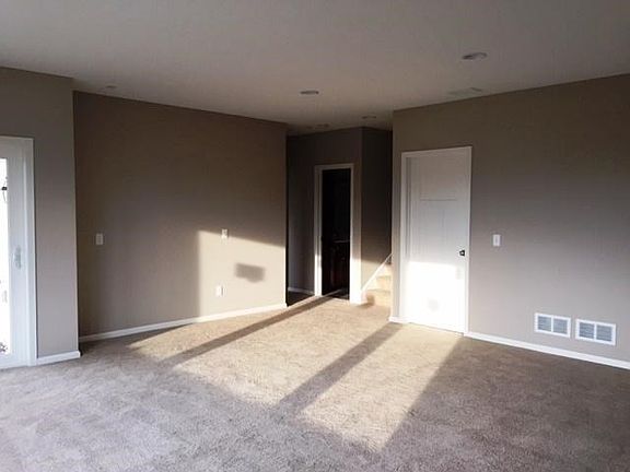 Spacious lower level family room with walkout to patio