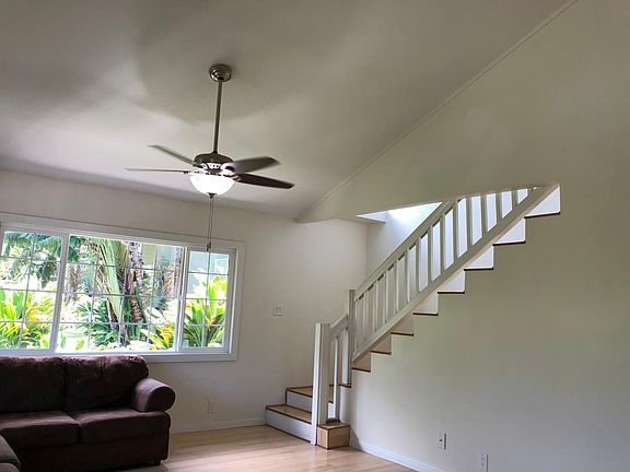 Downstairs living room with stairway to upstairs 