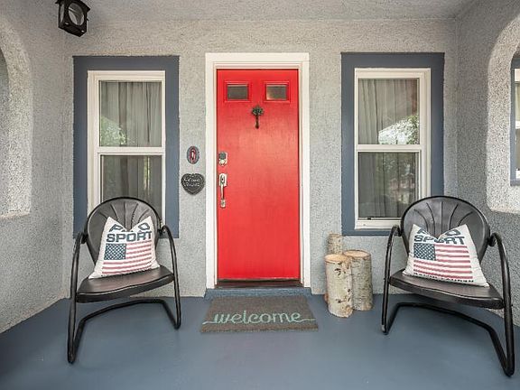 Front door and porch -- one of several places to sit and relax