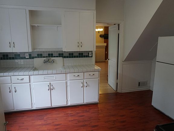 Large charming white tile kitchen