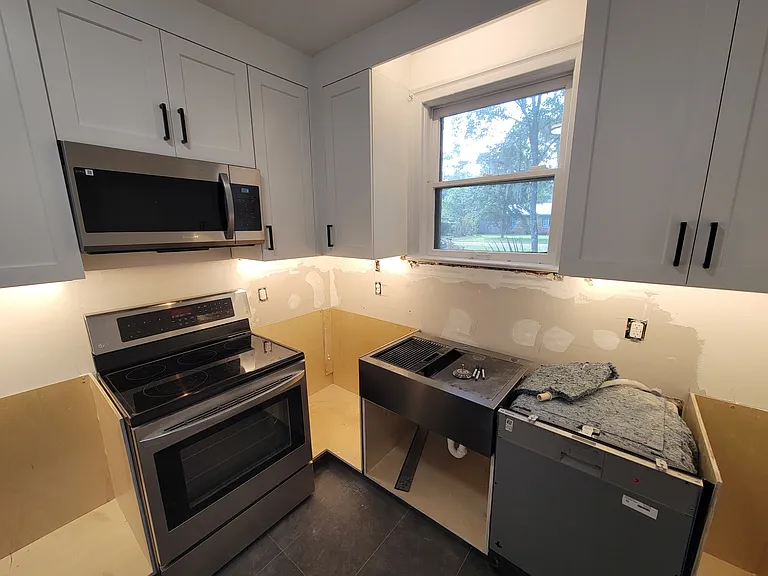 Kitchen in progress June 17, 2026; corner cabinet will have pot hanging carousel