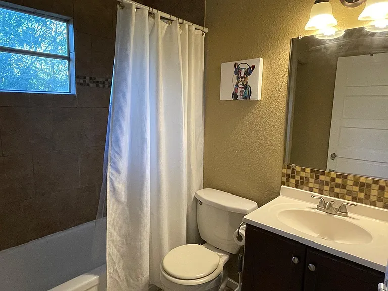 Bathroom with tub and shower