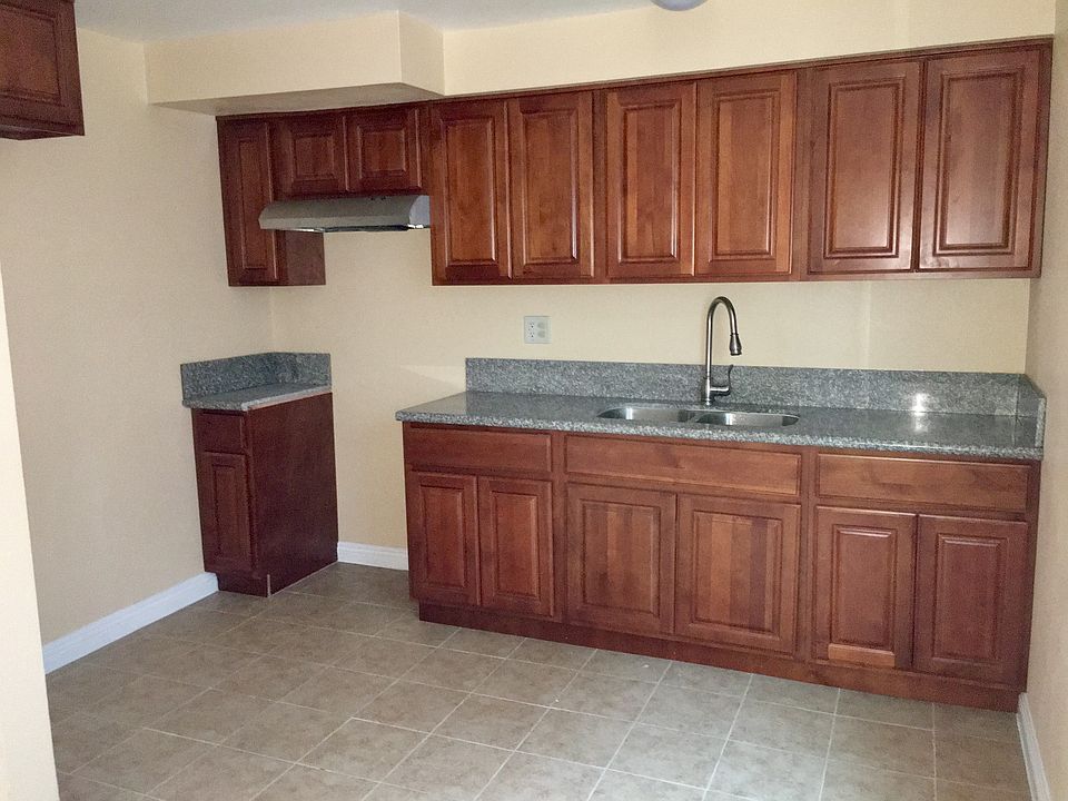 Beautiful cherry wood kitchen cabinets and granite counterto