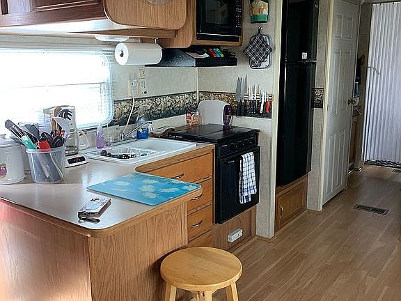 Full size fridge in kitchen