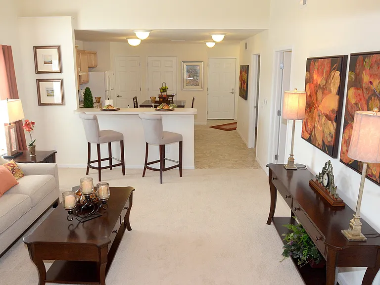Live in a Carpeted Floor Plan with Breakfast Bar Kitchen