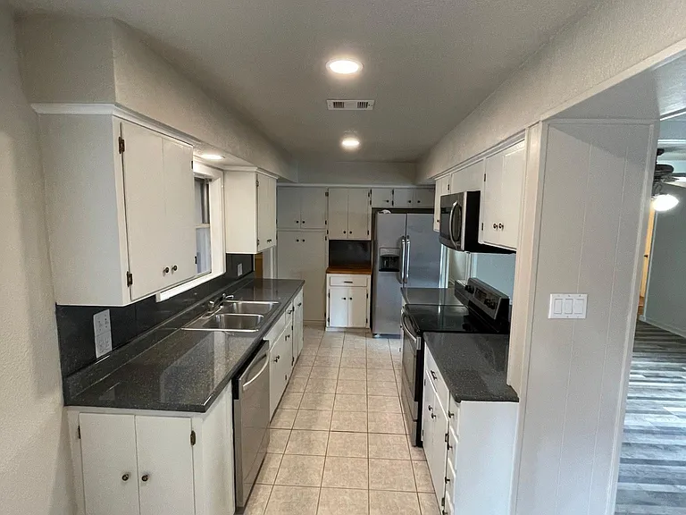 Nice layout on kitchen with butcher block for cutting and cooking.