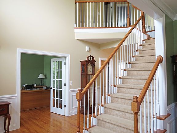 The dramatic foyer opens to the dining room and the office/study. 