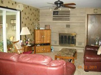 Which now leads us on into the gorgeous family room with fireplace to cuddle by on those cool nights