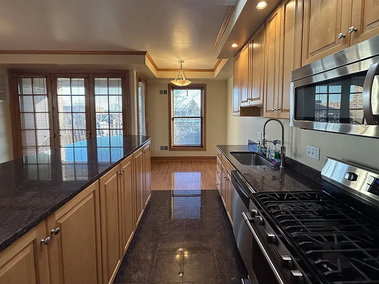 Gorgeous Kitchen granite countertops, large island, ample storage, stainless appliances, sun-lit