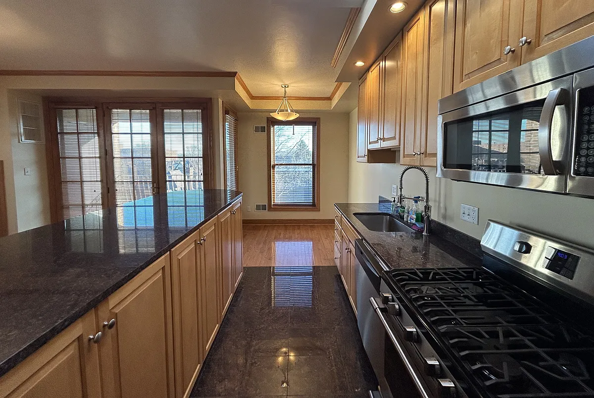 Gorgeous Kitchen granite countertops, large island, ample storage, stainless appliances, sun-lit - 6111 5th Ave #402