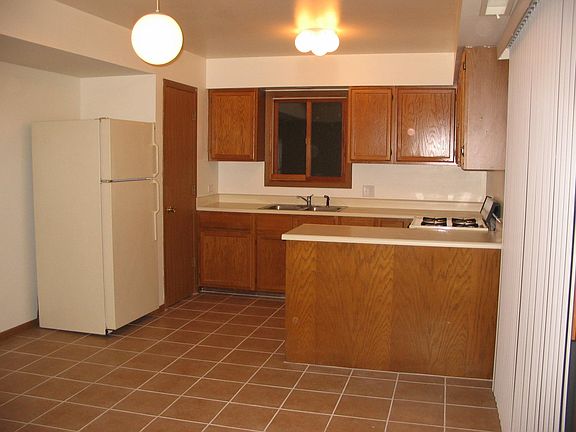 Kitchen with gas range/oven and separate pantry. Side-by-si