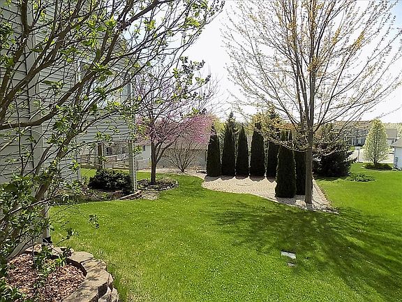 lovely back with brick firepit