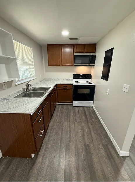 Fully Renovated 3BR/1BA Duplex W/D, Carport, Lawn Care & Water Included! — Photo 4