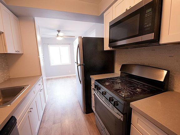 Another view of the kitchen. So easy to use. Great tile backsplash and corian counter tops.