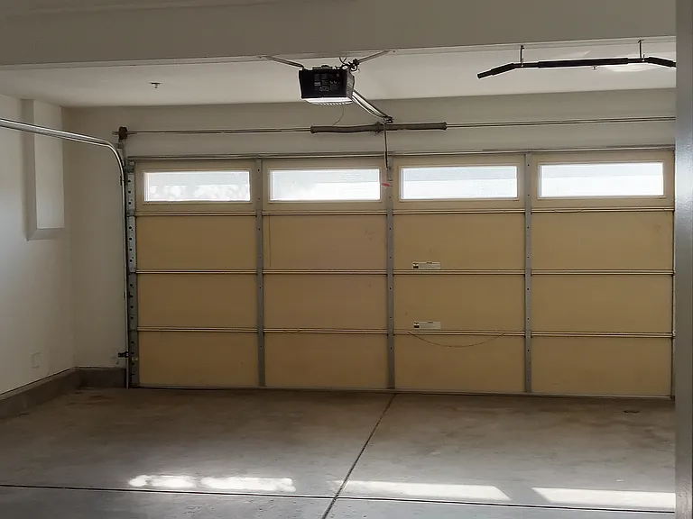 attached garage for two car parking with new garage code opener