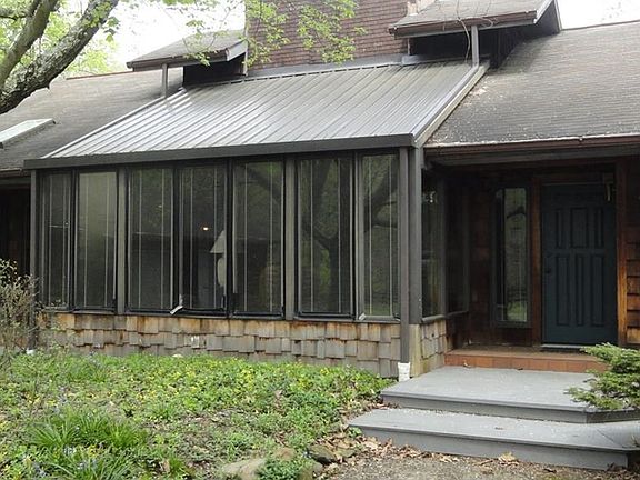 Closeup of front atrium and two entrances to home