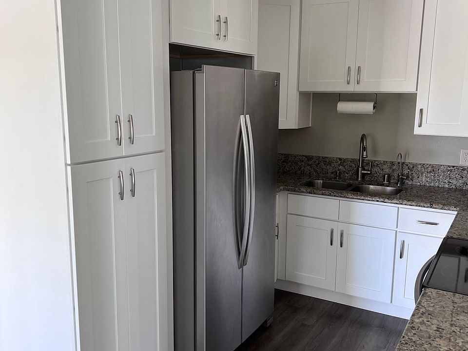 kitchen with full size refrigerator, reverse osmosis water, microwave, dishwasher, electric stove, and plenty of cabinet storage.
