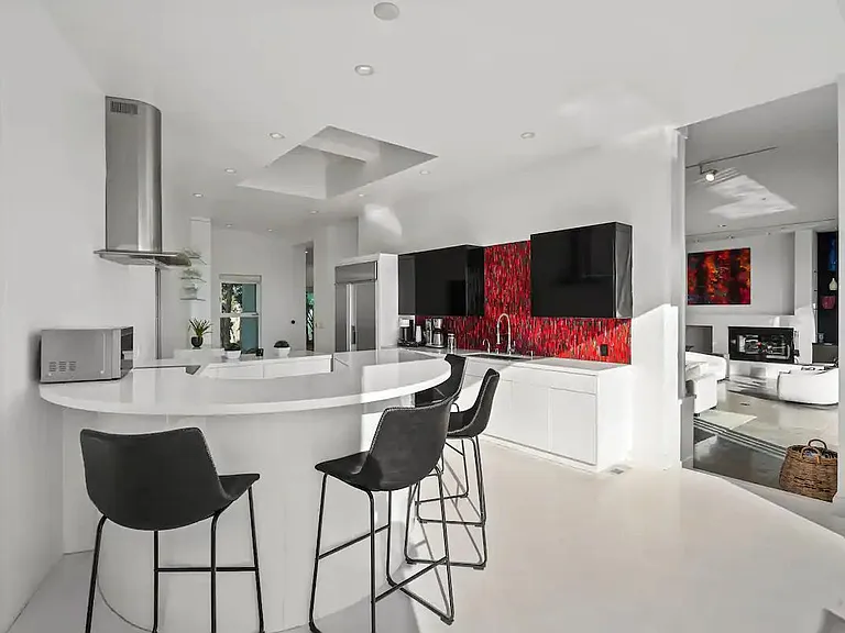 Abundant natural light floods the kitchen, creating a warm and inviting atmosphere.