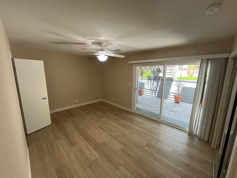 Downstairs back bedroom, access to back patio, fenced back yard