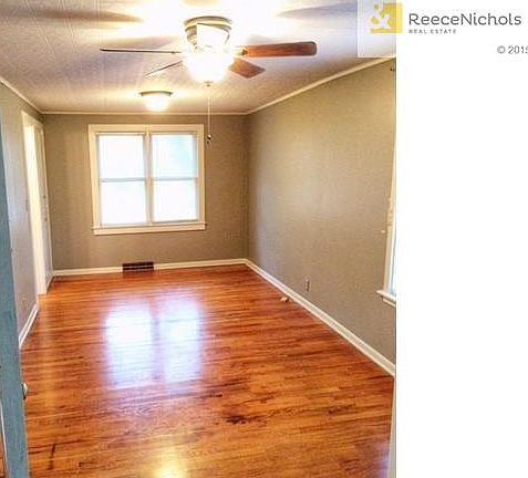spacious main level master bedroom with hardwoods, walk-in closet