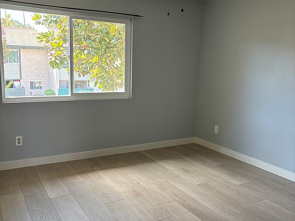 Large bedroom with recessed lighting and ceiling fans