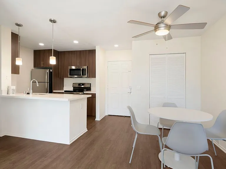 Furnished+ apartment homes include a dining set (Representative Image exact items and style of furnishings may vary)
