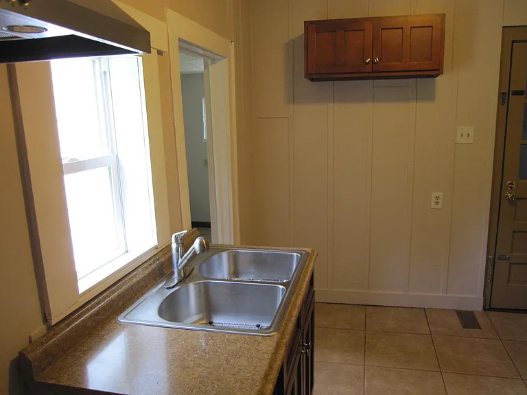Another angle view of kitchen. Newer LG Refrigerator not shown in picture.