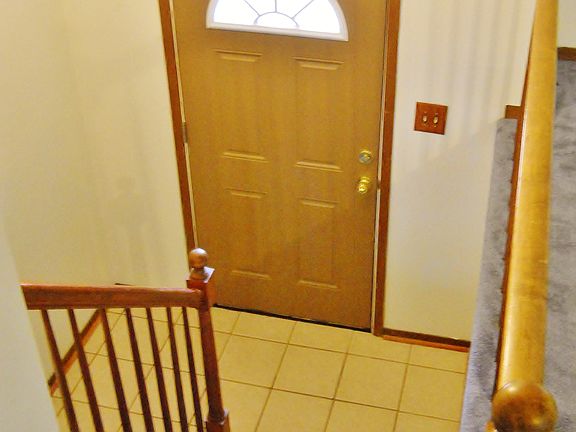Ceramic Tiled Split Entry Foyer