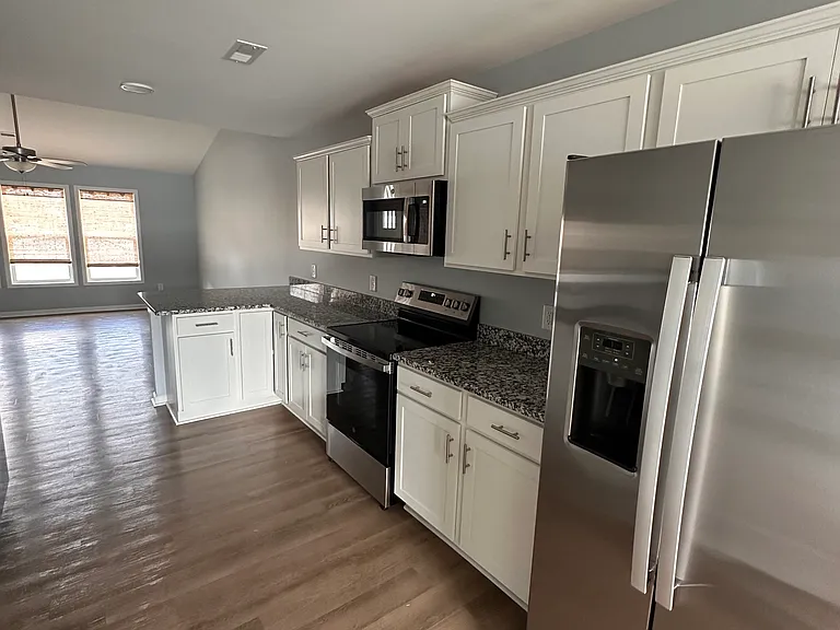 Kitchen with appliances and granite countertops
