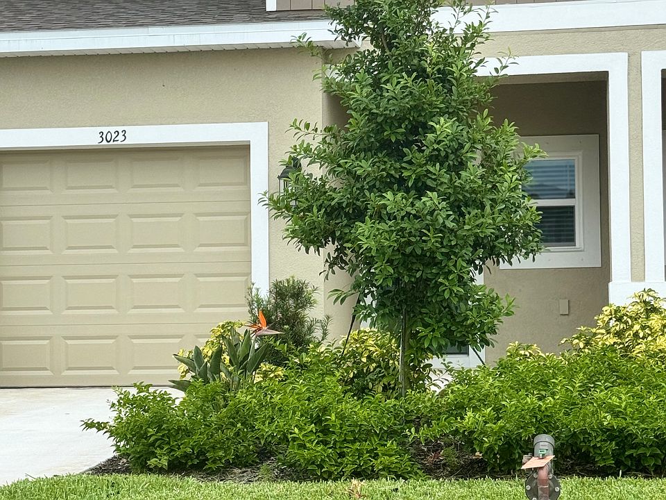 Entrance to condo with a small patio