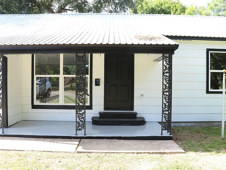 Charming covered front porch, perfect for morning coffee or evening relaxation