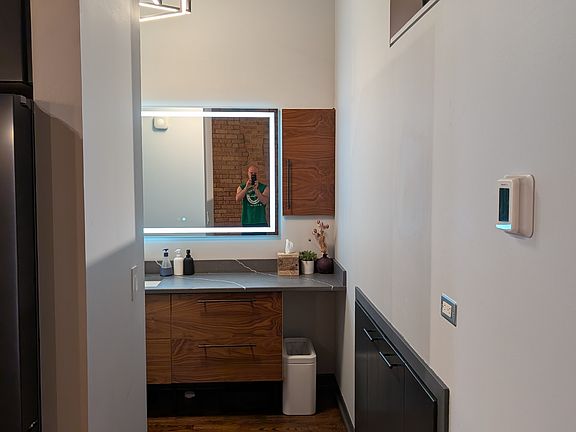 Front-lit mirror for visibility when shaving or applying makeup.