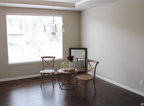 Ample formal dining room with hardwoods and coiffured ceilings.  Large windows let the sunshine in.