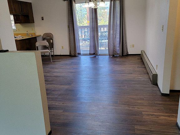 Entry way looking at dinning room and sliding doors to redwood deck,