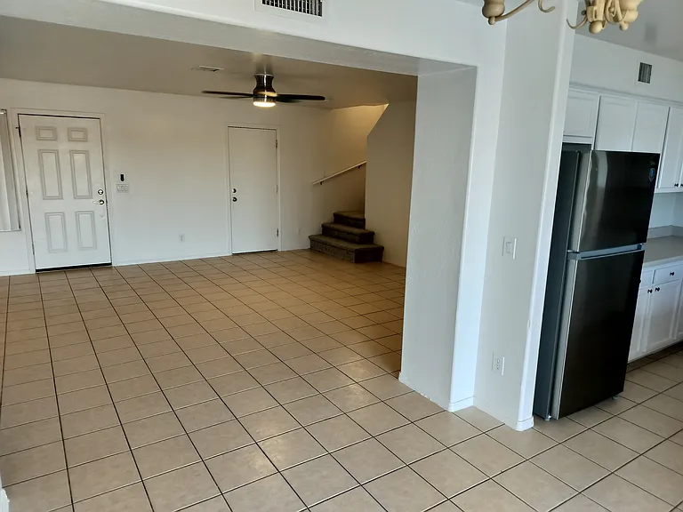 From kitchen towards front door and upstairs