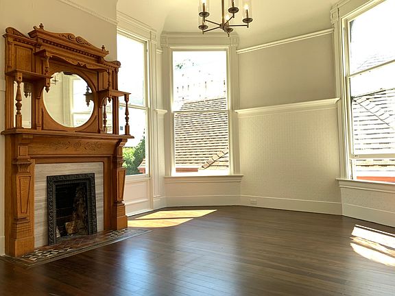 Formal Dining with decorative fireplace and built-in cabinet