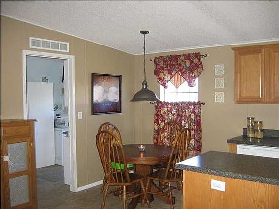 Eat in kitchen leads to laundry room and back door.
