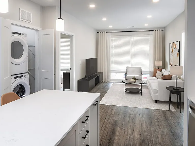 Upgrade Collection living room with in-home washer and dryer and hard-surface flooring
