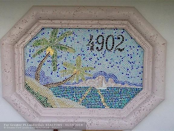 Beautiful large custom mosaic address plate adorns home by local artist.