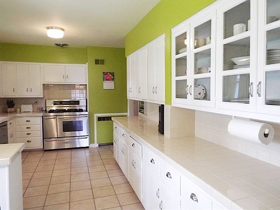 Refrigerator, 36 inch gas range, and dishwasher.