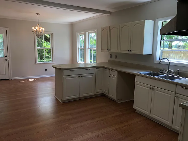 Open kitchen with breakfast bar and large dining area with lots of windows overlooking yard!
!
