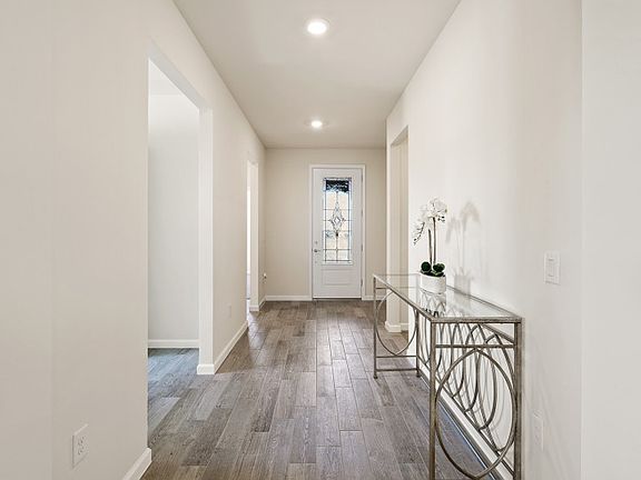 A bright inviting foyer welcome you to a popular floor plan