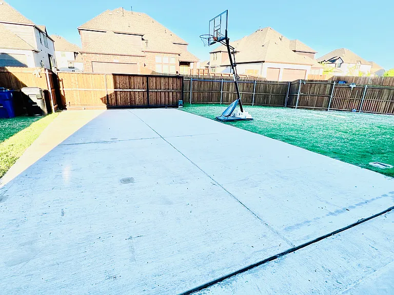 Private backyard with an extended fence and secure gate